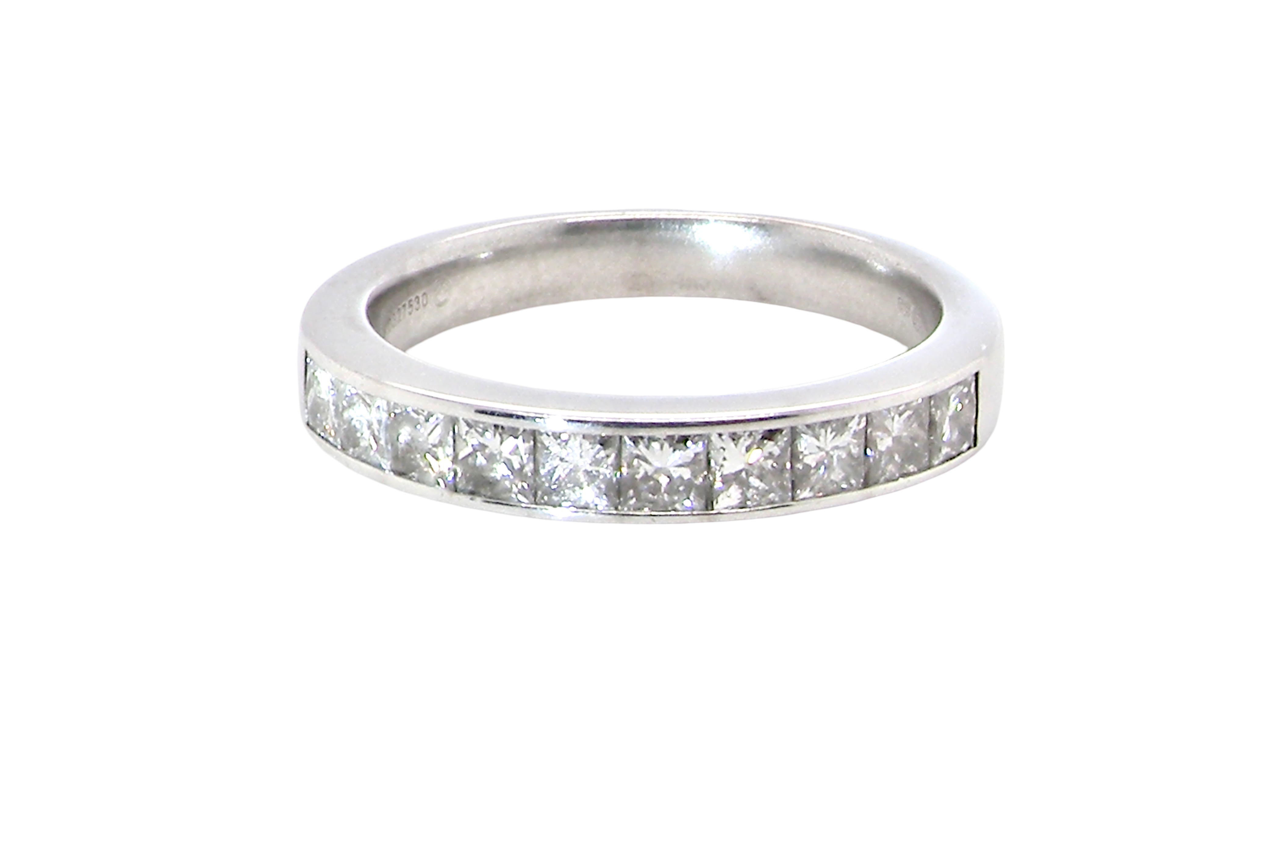 A fine 18 carat white gold half hoop eternity ring. Set with ten princess cut white diamonds.
Close set, each 2.5x2.5mm,