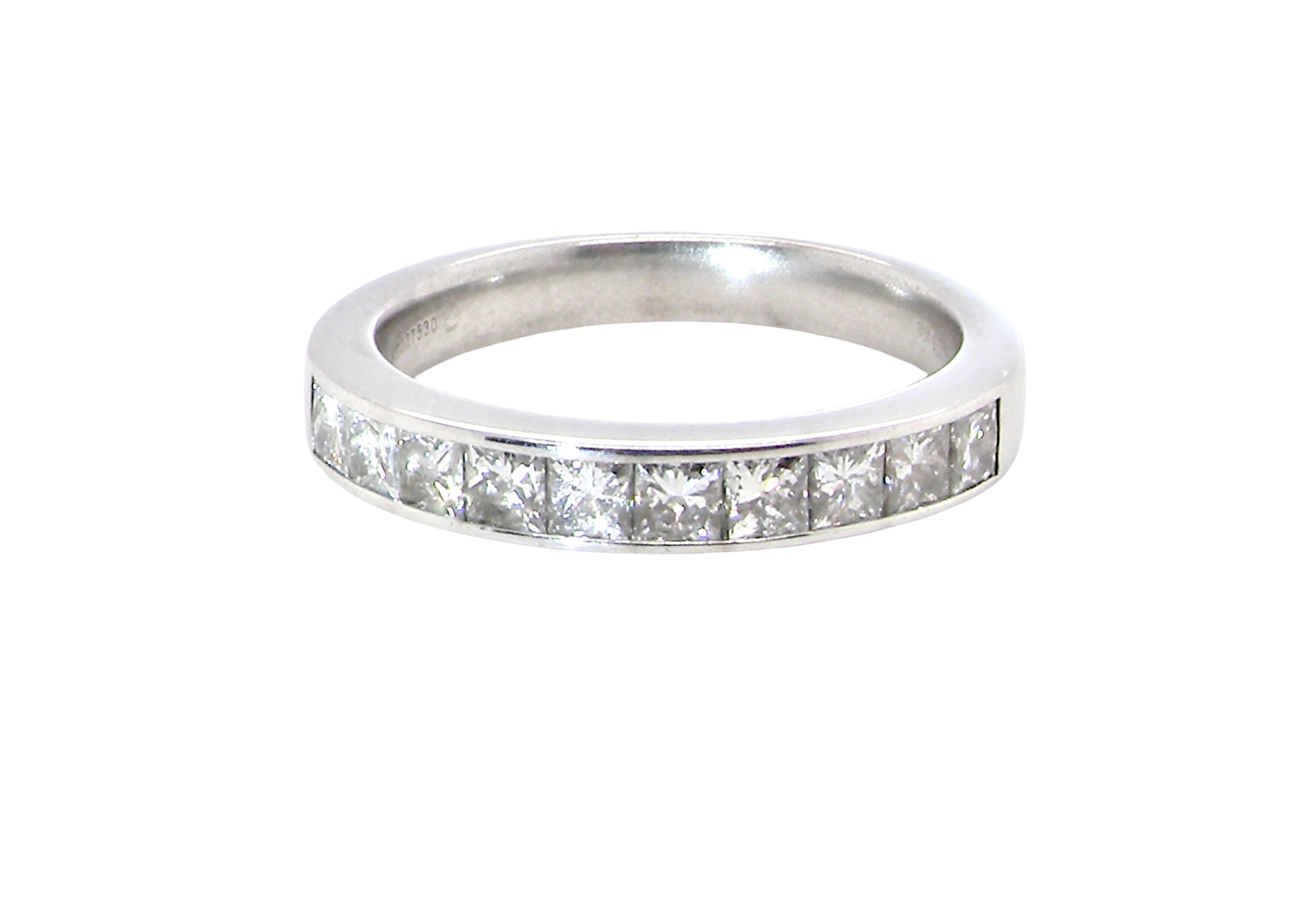 A fine 18 carat white gold half hoop eternity ring. Set with ten princess cut white diamonds.
Close set, each 2.5x2.5mm,
