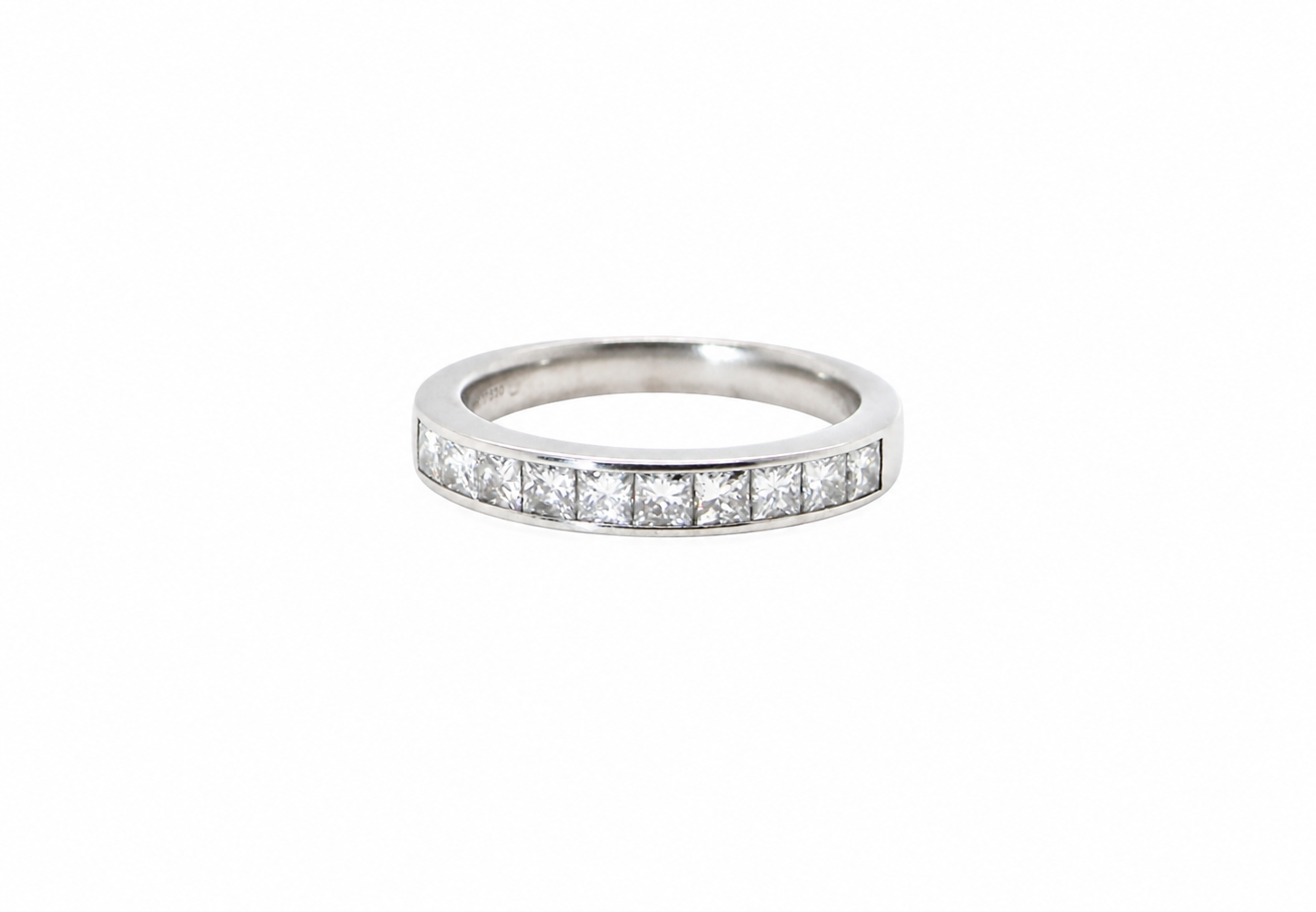 A fine 18 carat white gold half hoop eternity ring. Set with ten princess cut white diamonds.
Close set, each 2.5x2.5mm, total one carat