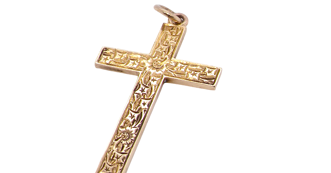 A fine 9 carat gold cross. Hand engrarved across the whole body of the cross