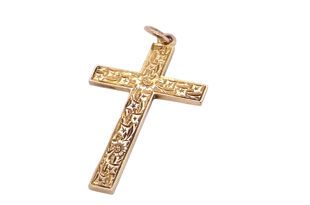 A fine 9 carat gold cross. Hand engrarved across the whole body of the cross
