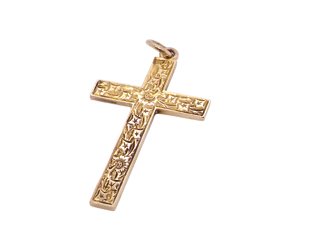 A fine 9 carat gold cross. Hand engrarved across the whole body of the cross