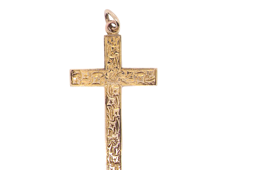 A fine 9 carat gold cross. Hand engrarved across the whole body of the cross which measures 45x25mm