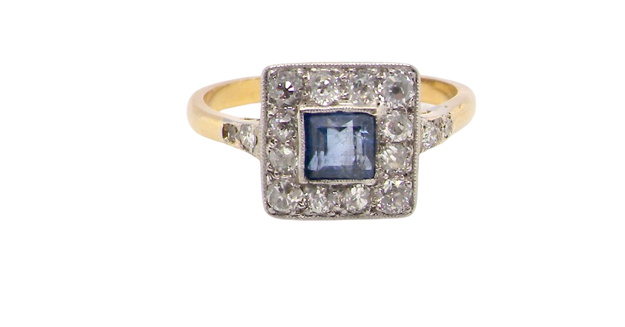 A fine Art Deco cluster ring. The centre stone a square sapphire 5x5mm (est 0.50 carats) in a mille grain setting.