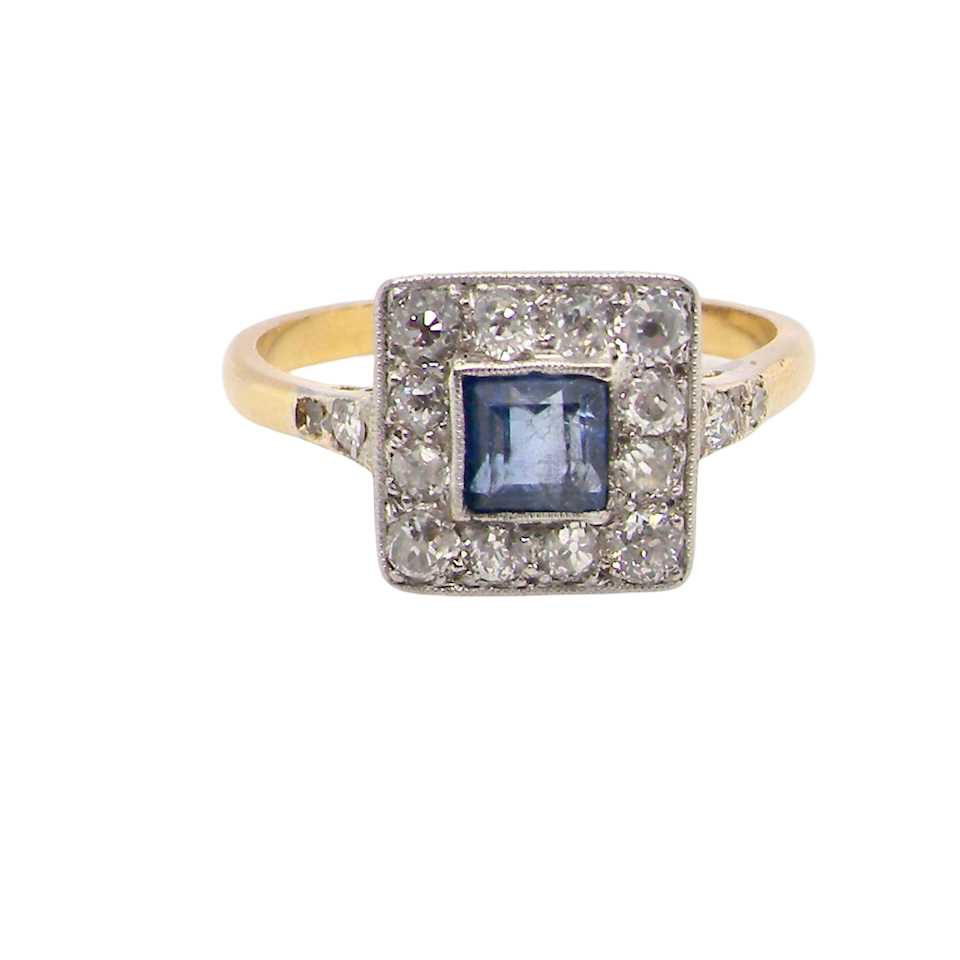 A fine Art Deco cluster ring. The centre stone a square sapphire 5x5mm (est 0.50 carats) in a mille grain setting.
