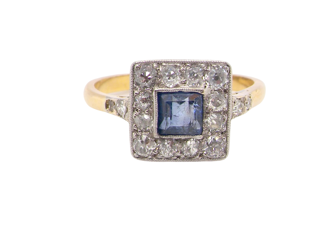 A fine Art Deco cluster ring. The centre stone a square sapphire 5x5mm in a mille grain setting.