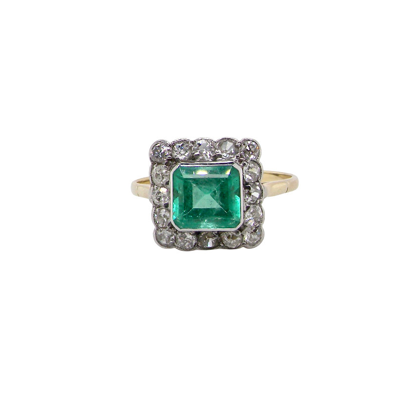 A fine Art Deco emerald and diamond cluster ring, beautifully proportioned and displaying all the elegance associated with the era