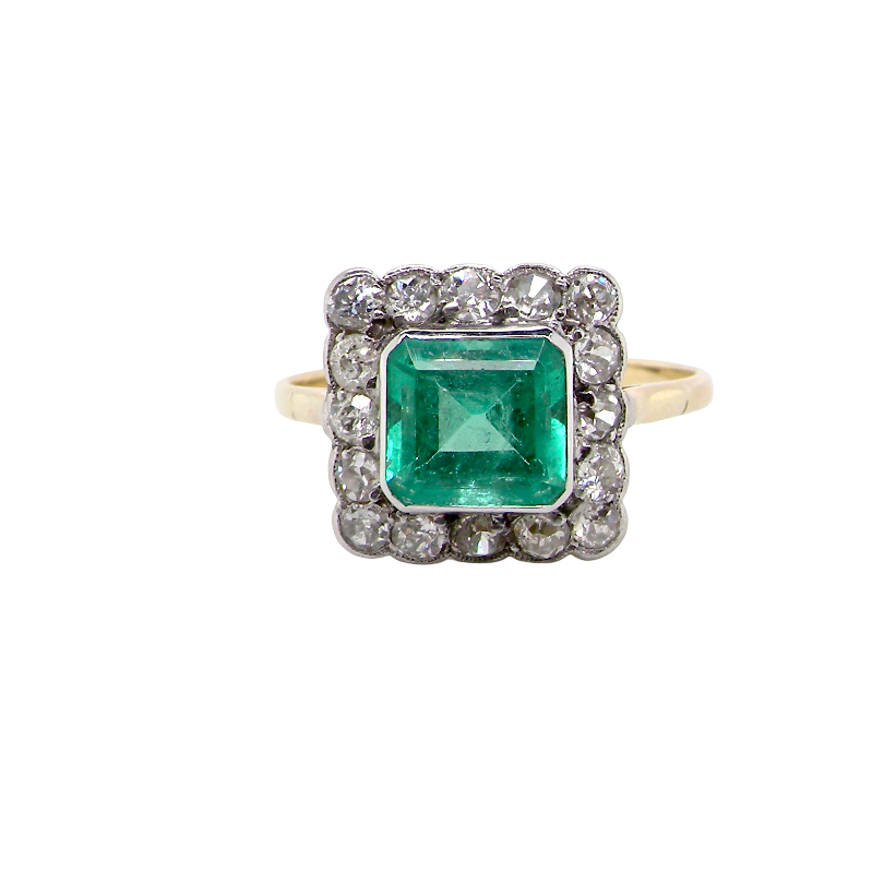 A fine Art Deco emerald and diamond cluster ring, beautifully proportioned and displaying all the elegance associated with the period.