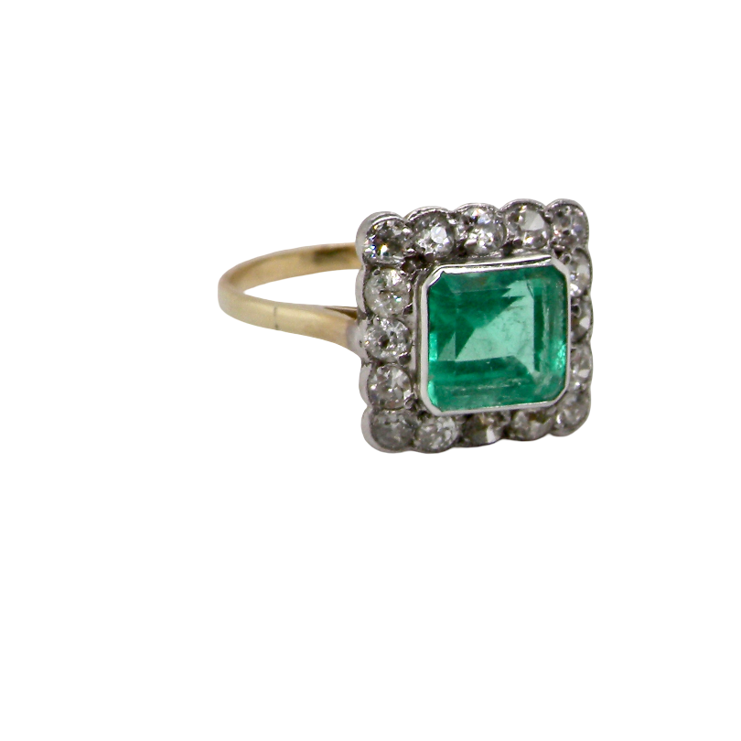 A fine Art Deco emerald and diamond cluster ring, beautifully proportioned and displaying all the elegance associated with the period. side