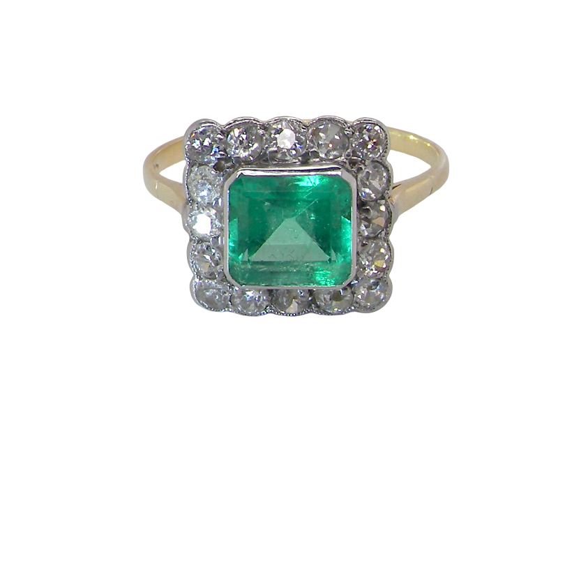 A fine Art Deco emerald and diamond cluster ring, proportioned and displaying all the elegance associated with the period.