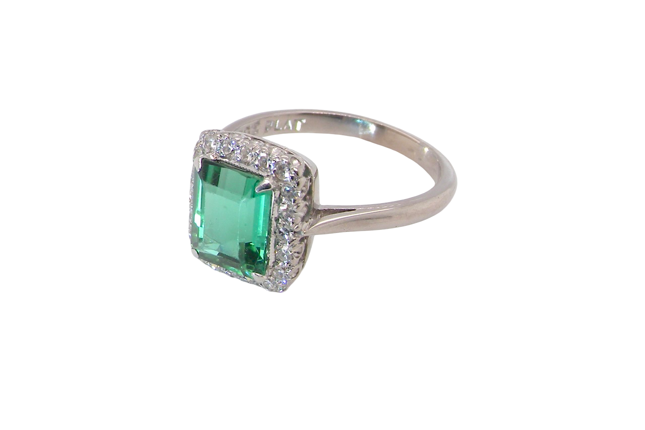 A fine Green Tourmaline and Diamond ring side