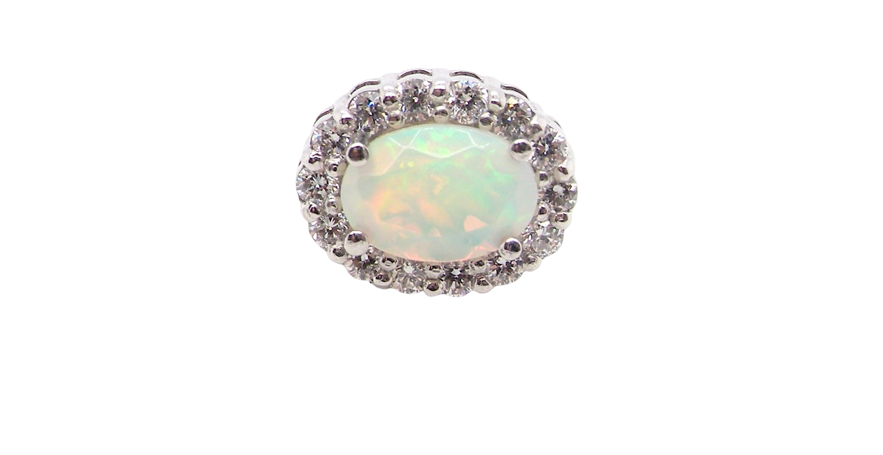 platinum* stud earrings beautifully set with an exceptional white opal measuring 7 x 5mm. T