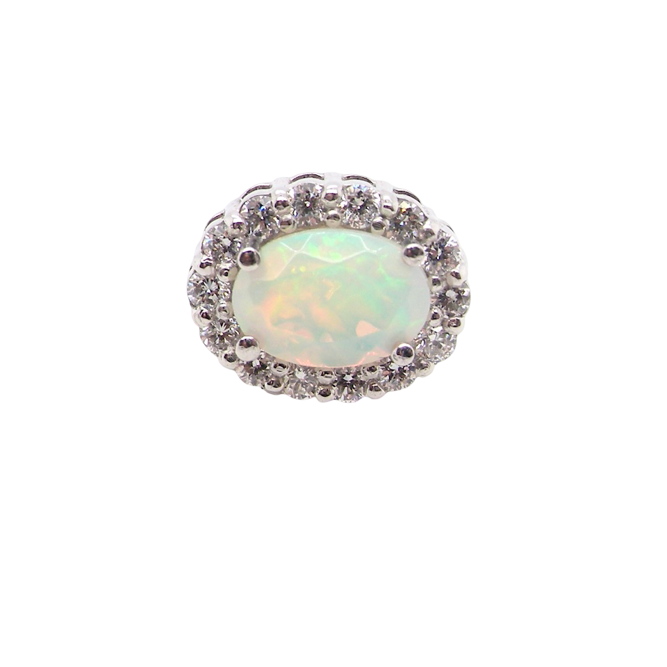 platinum* stud earrings beautifully set with an exceptional white opal measuring 7 x 5mm. T