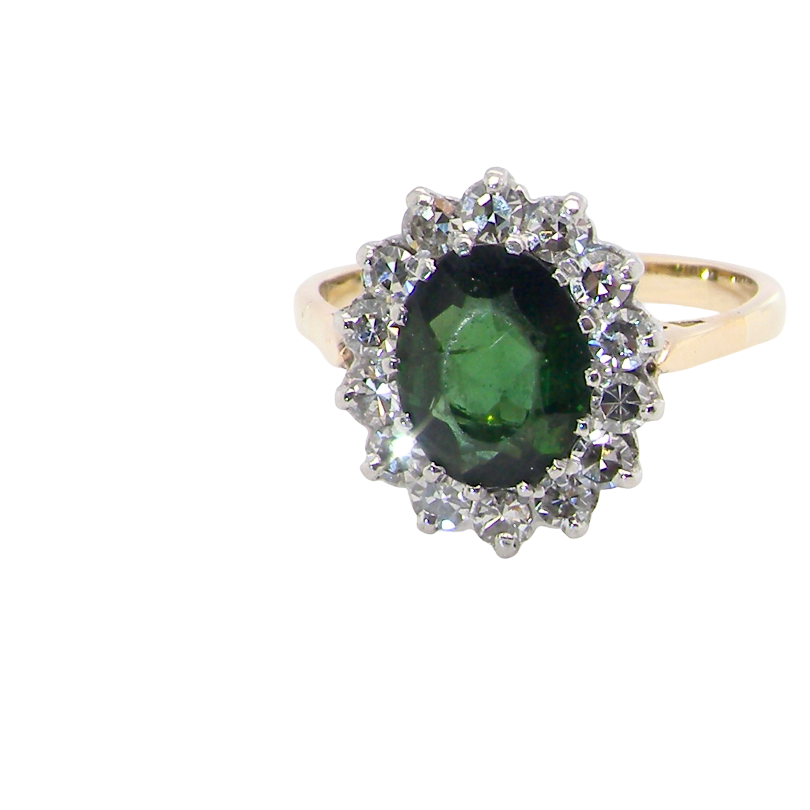 A fine and impressive vintage cluster ring, centred with a striking oval-cut deep dark green tourmaline, measuring 9 x 7mm and estimated to weigh 2.00 carats.
