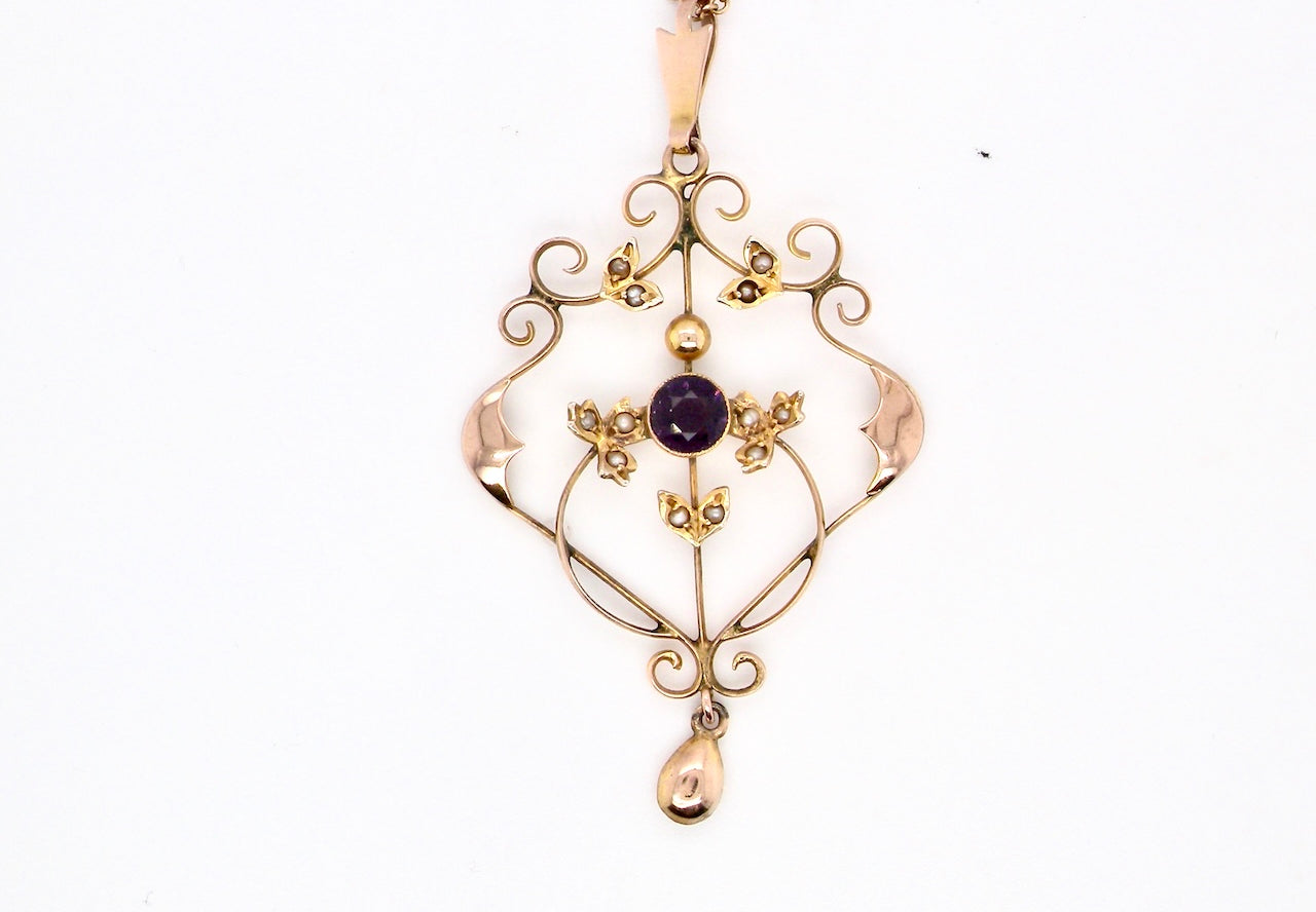 A fine antique pendant. Victorian openwork design, measures 40x30mm.