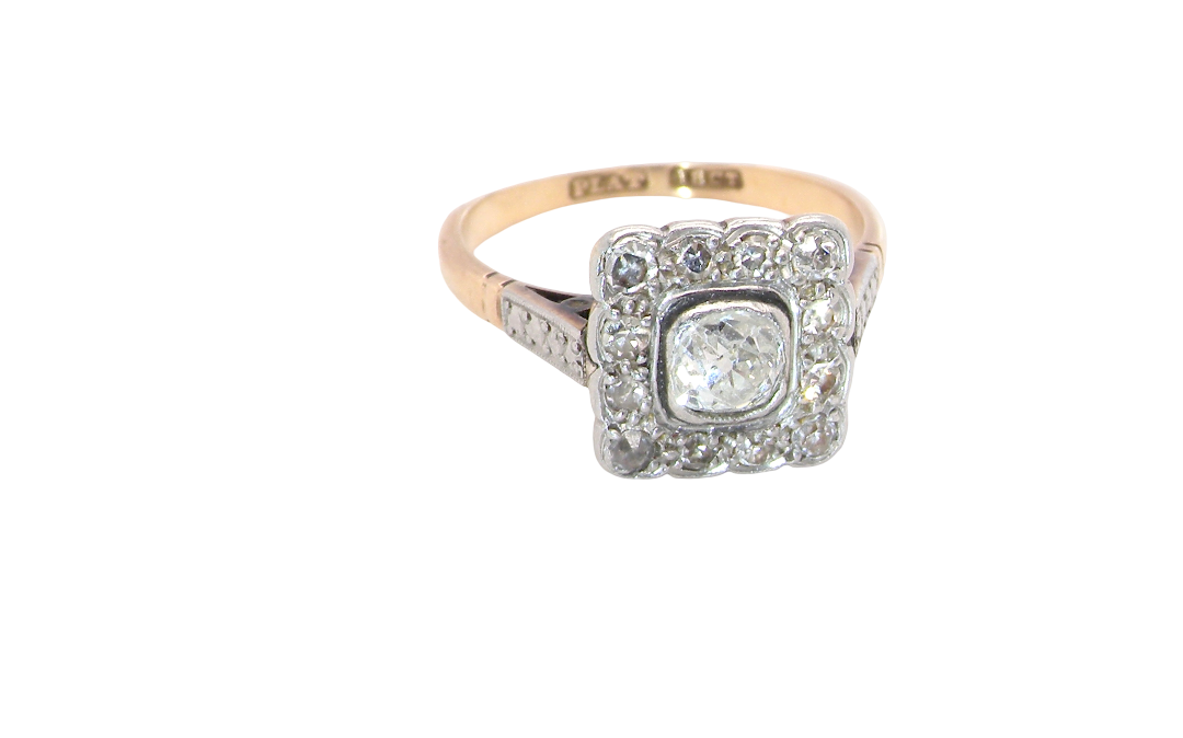 A fine antique ring from the early part of the 20th century (probably 1915-1925)
A square head that measures 11x11mm is set with old brilliant cut white diamonds. The principal stone measures just over half a carat (5.2mm) colour i-l,