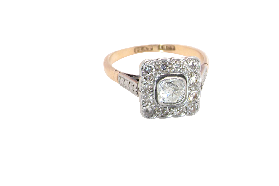 A fine antique ring from the early part of the 20th century (probably 1915-1925)
A square head that measures 11x11mm is set with old brilliant cut white diamonds. The principal stone measures just over half a carat (5.2mm) colour i-l,