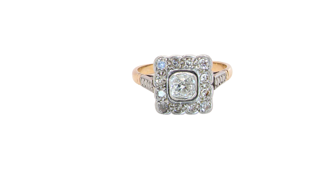 A fine antique ring from the early part of the 20th century (probably 1915-1925)
A square head that measures 11x11mm is set with old brilliant cut white diamonds. The principal stone measures just over half a carat (5.2mm) colour i-l, clarity Si, rim setting, platinum.