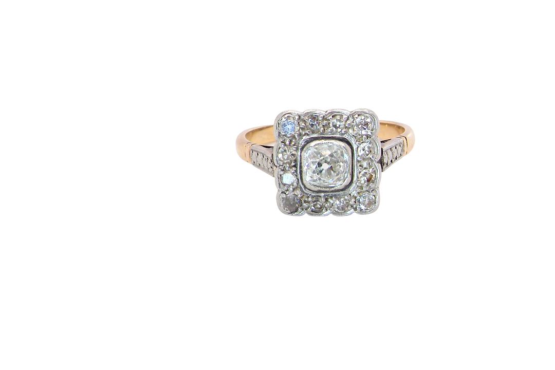 A fine antique ring from the early part of the 20th century (probably 1915-1925)
A square head that measures 11x11mm is set with old brilliant cut white diamonds. The principal stone measures just over half a carat (5.2mm) colour i-l, clarity Si, rim setting, platinum.