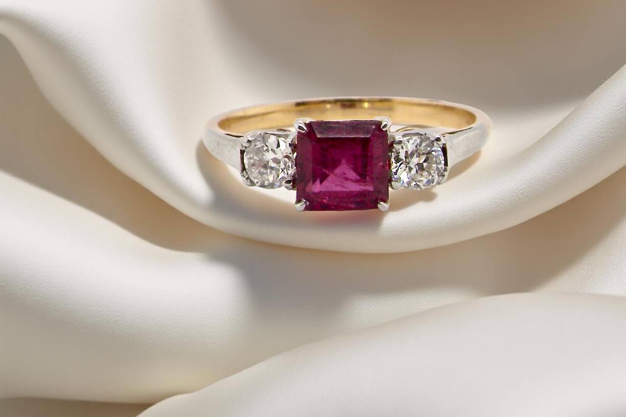 A classic Ruby and Diamond trilogy ring