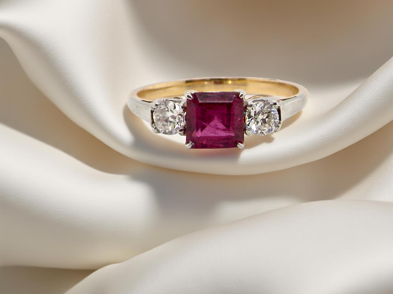 A classic Ruby and Diamond trilogy ring