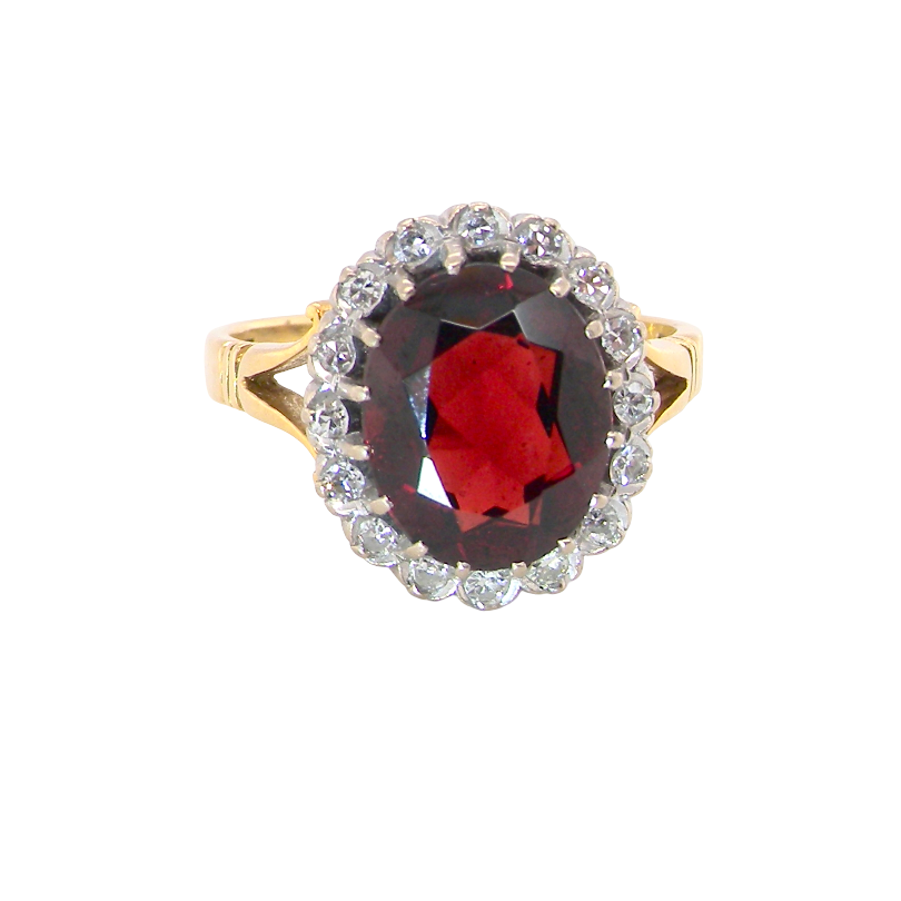 A fine cluster ring. Features a large garnet centre stone
Complimented by an outer halo of brilliant cut white diamonds. 