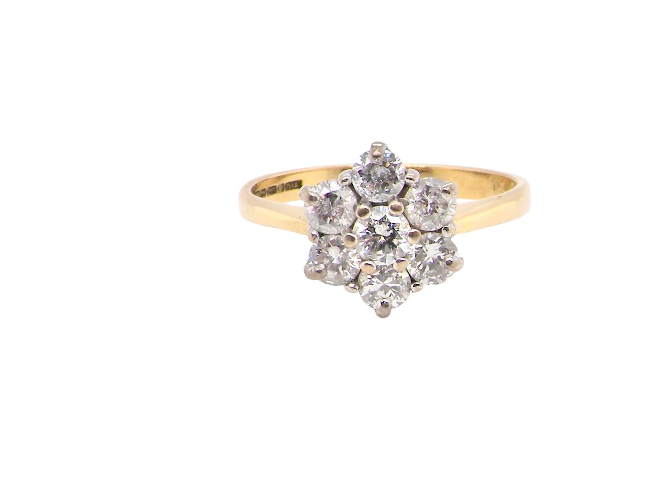 Gold ring with diamond cluster on a white background