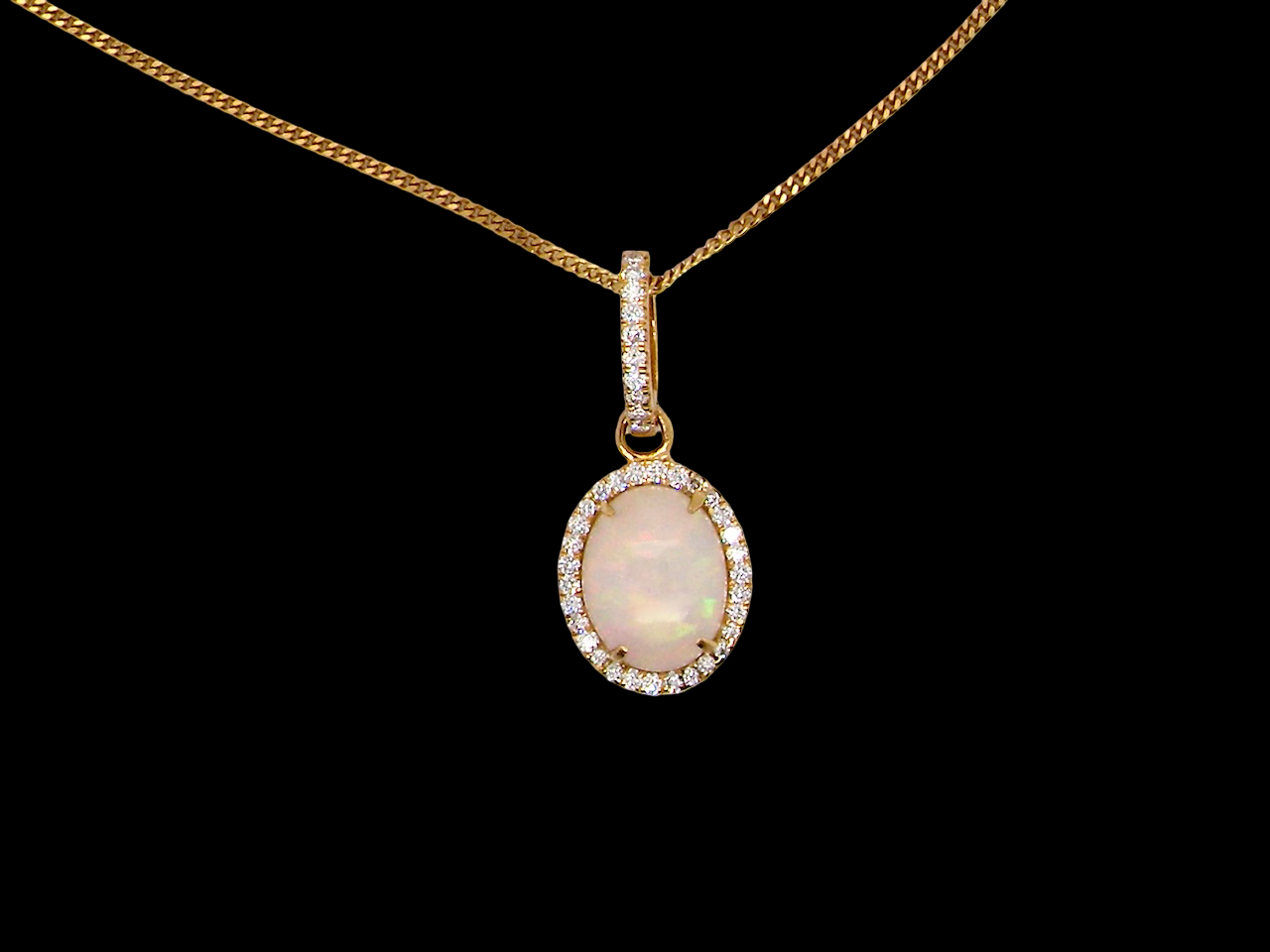 A fine opal and diamond pendant 1