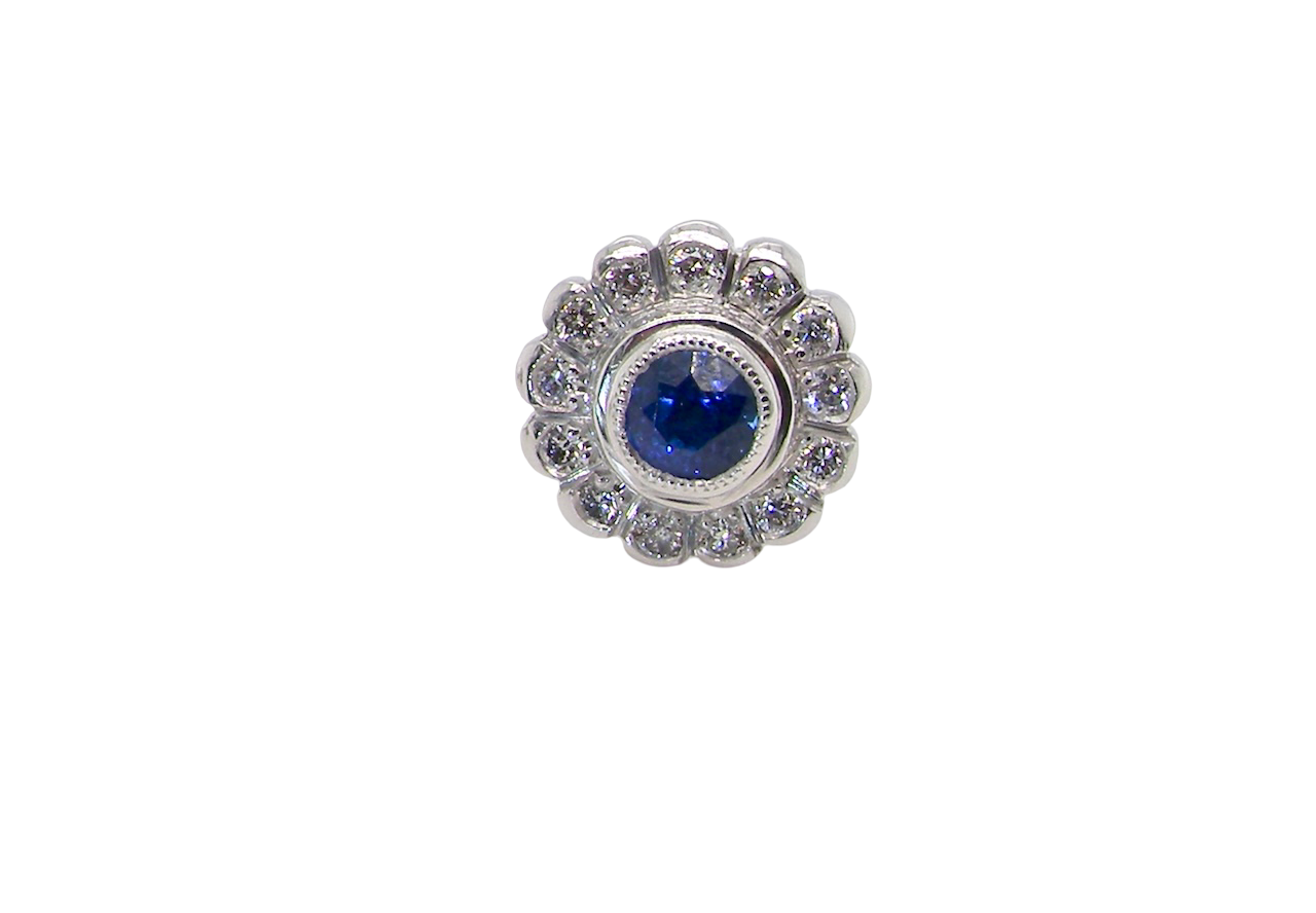 A fine pair of 18 carat white gold sapphire and diamond cluster earring
Each earring is set with a central round sapphire measuring approximately 3.4mm in diameter, estimated at 0.15ct,