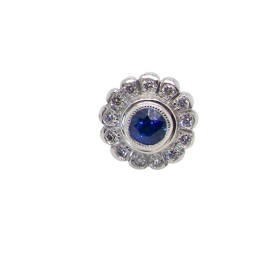 A fine pair of 18 carat white gold sapphire and diamond cluster earring
Each earring is set with a central round sapphire measuring approximately 3.4mm in diameter, estimated at 0.15ct,