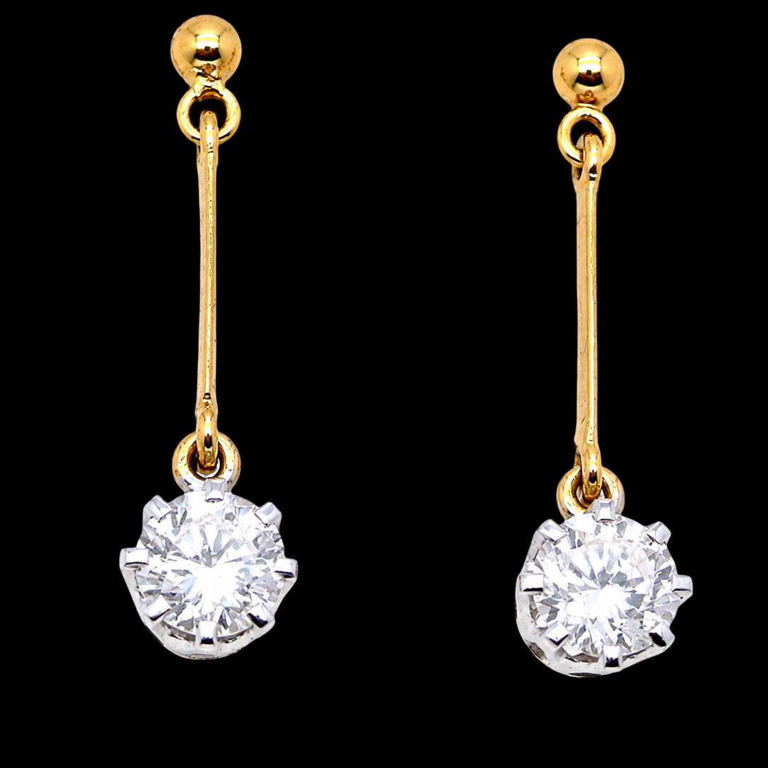 A fine pair of 18 carat yellow gold drop earrings.
Each modern brilliant cut white diamond measures 5mm (est half a carat each),