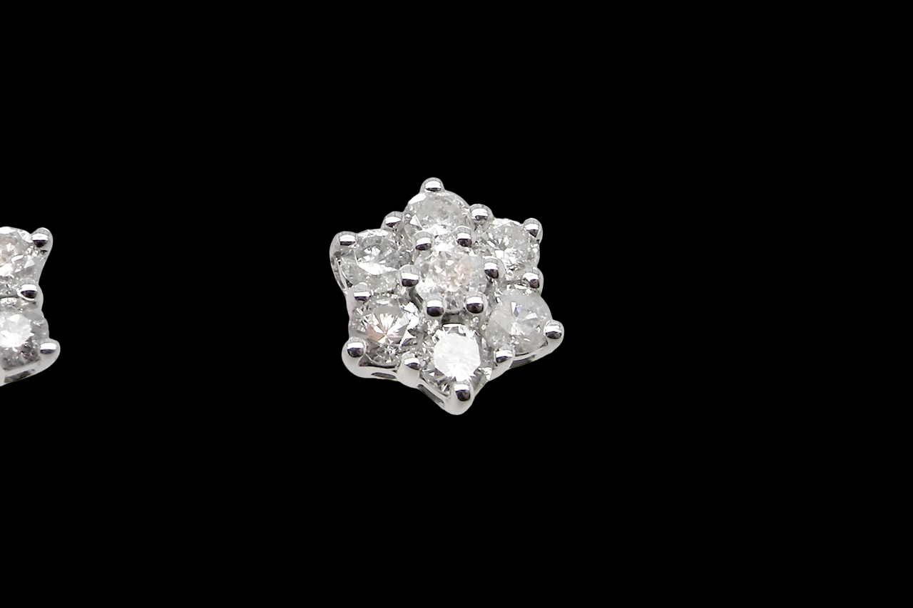 A fine pair of 9 carat white gold diamond stud earrings. A