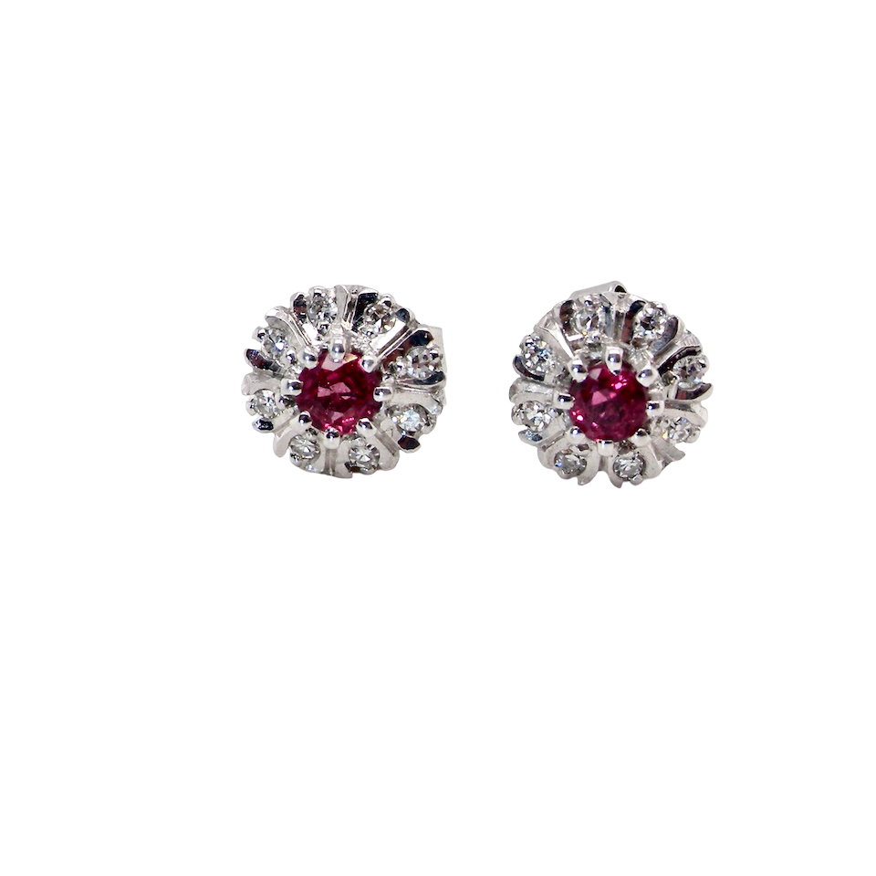 A fine pair of cluster earrings. Features to the centre a round 4.6mm pink sapphire (est 0.38 carats) with a good deep colour hue.