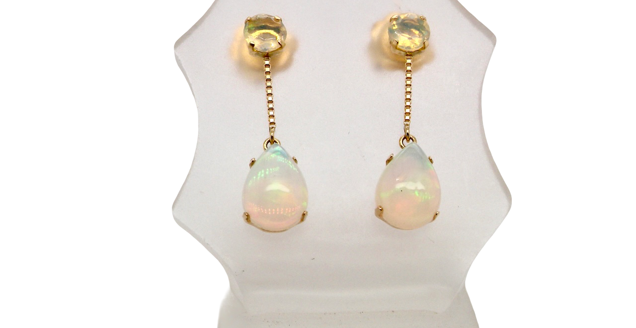 A fine pair of drop earrings. Suspending from a round opal which is at the head of the post, (measures 4mm) a pear shaped opal 8x6mm, and attached to a 9mm box link chain.