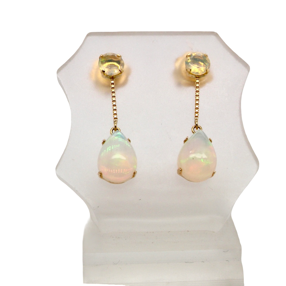 A fine pair of drop earrings. Suspending from a round opal which is at the head of the post, (measures 4mm) a pear shaped opal 8x6mm, and attached to a 9mm box link chain.