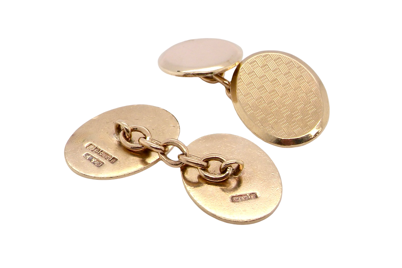rear A fine pair of vintage 9 carat gold double cufflinks, both oval in form and measuring approximately 20 × 14 mm.