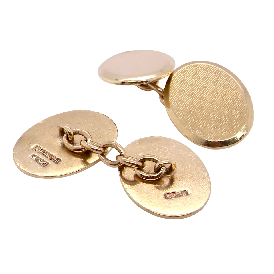 rear A fine pair of vintage 9 carat gold double cufflinks, both oval in form and measuring approximately 20 × 14 mm.