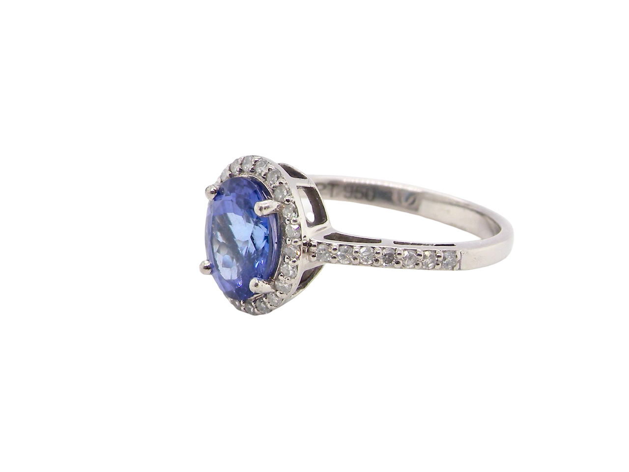 A fine platinum cluster ring with a vibrant AAA tanzanite A