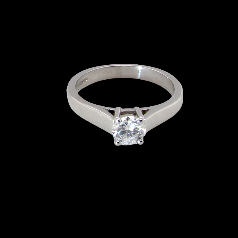 A fine solitaire ring, features an exceptional half carat diamond, brilliant cut, colour H-j, clarity VS2-Si1. Measures 5.2mm, depth 5.5mm,