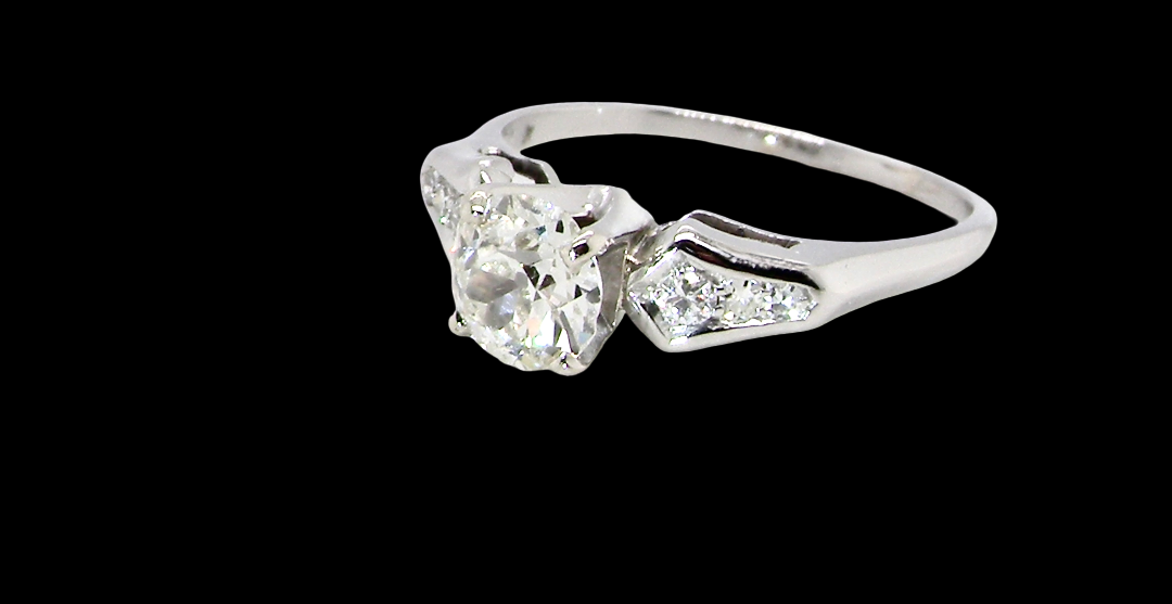 A fine solitaire ring featuring an e lovely brilliant cut white diamond. Measures 6.3mm (est 0.85 carats) very bright white stone, colour H-i, clarity VS. Head depth 7mm.
side