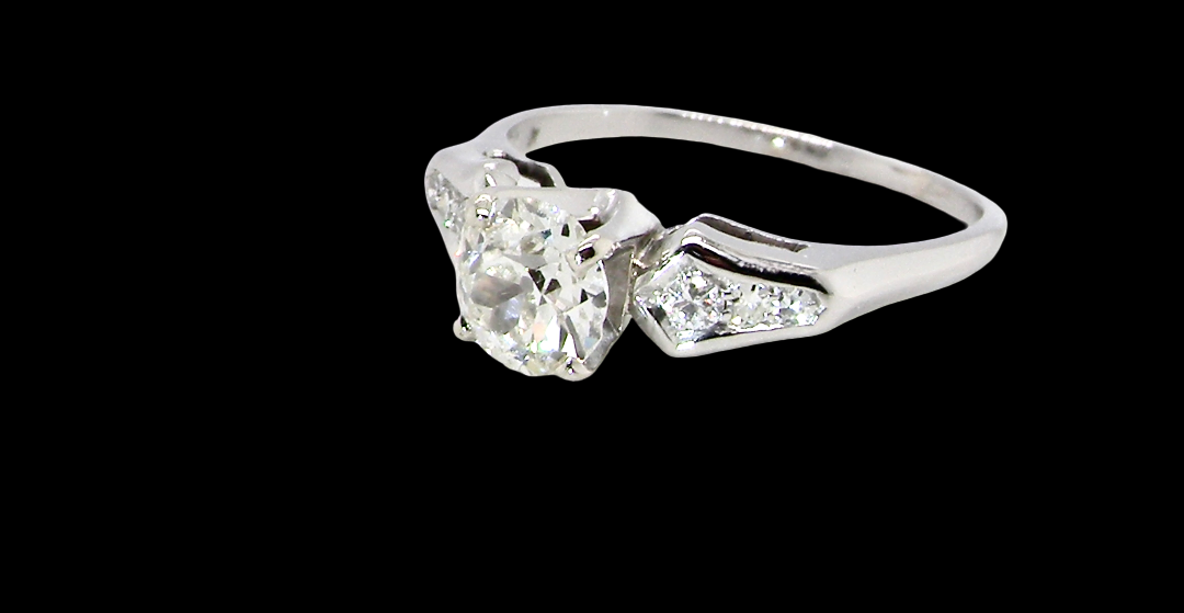 A fine solitaire ring featuring an e lovely brilliant cut white diamond. Measures 6.3mm (est 0.85 carats) very bright white stone, colour H-i, clarity VS. Head depth 7mm.
side