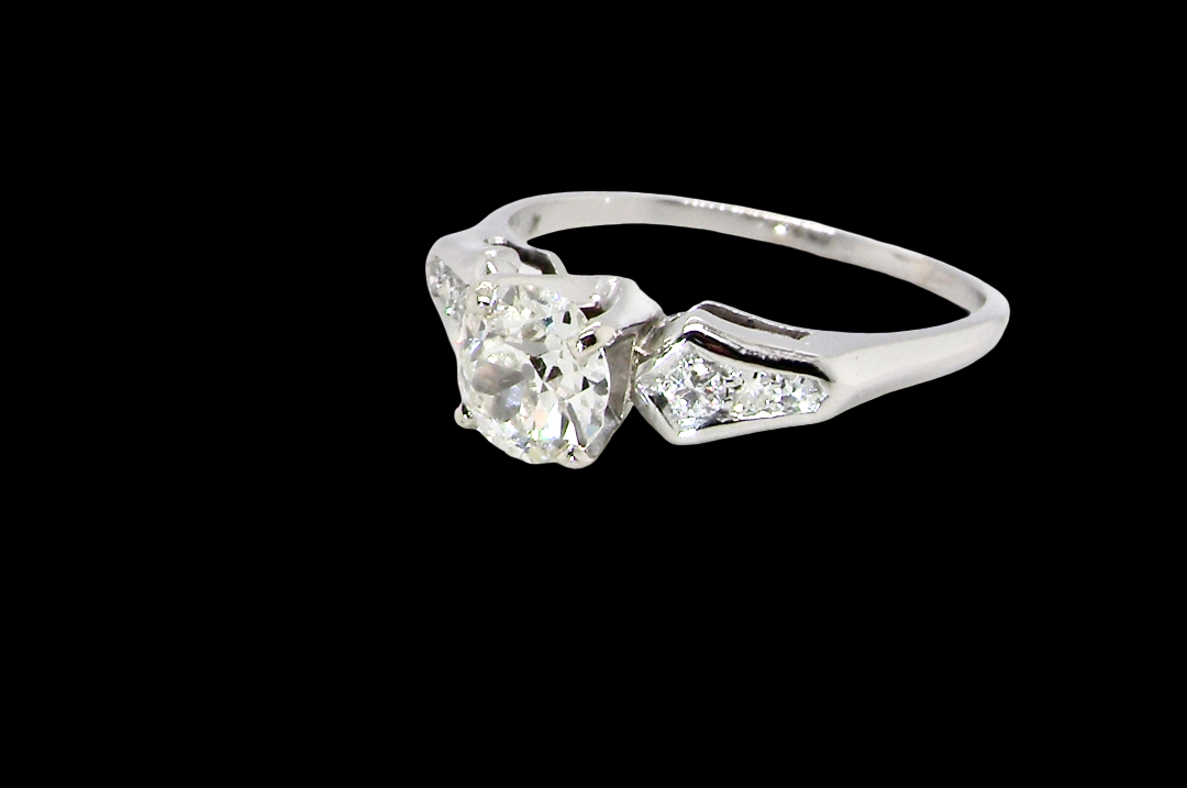 A fine solitaire ring featuring an e lovely brilliant cut white diamond. Measures 6.3mm (est 0.85 carats) very bright white stone, colour H-i, clarity VS. Head depth 7mm.
side