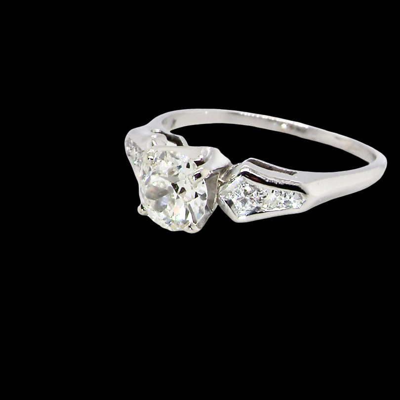 A fine solitaire ring featuring an e lovely brilliant cut white diamond. Measures 6.3mm (est 0.85 carats) very bright white stone, colour H-i, clarity VS. Head depth 7mm.
side