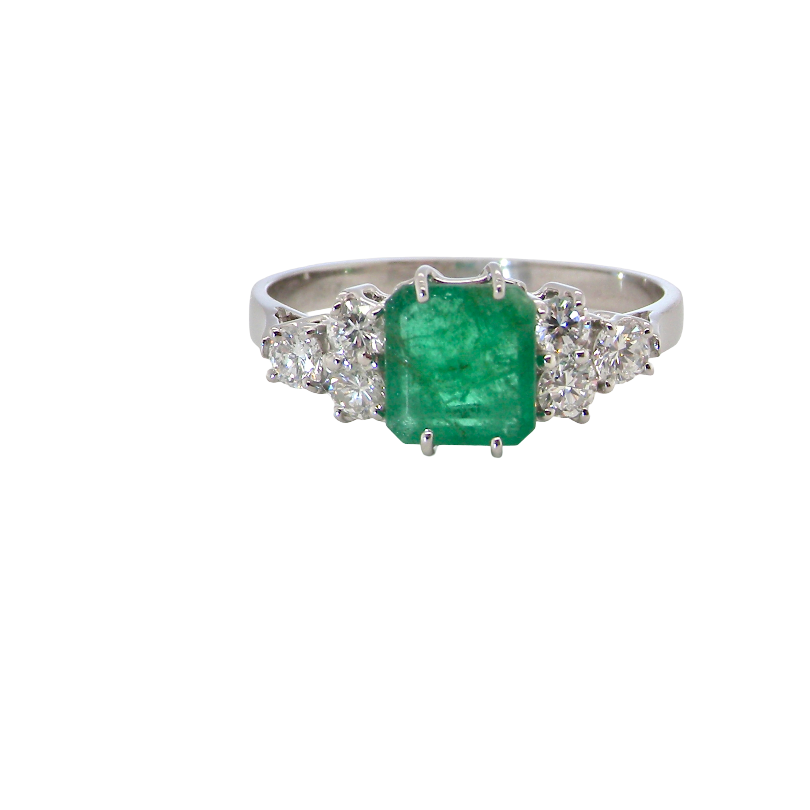 A fine white gold* ring that features a rectangular emerald centre stone, measures 6x6.5mm (est one carat), mid to dark green hue, natural inclusions as with most emeralds.