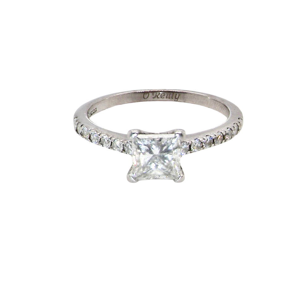 Diamond ring with a clear gemstone on a white background