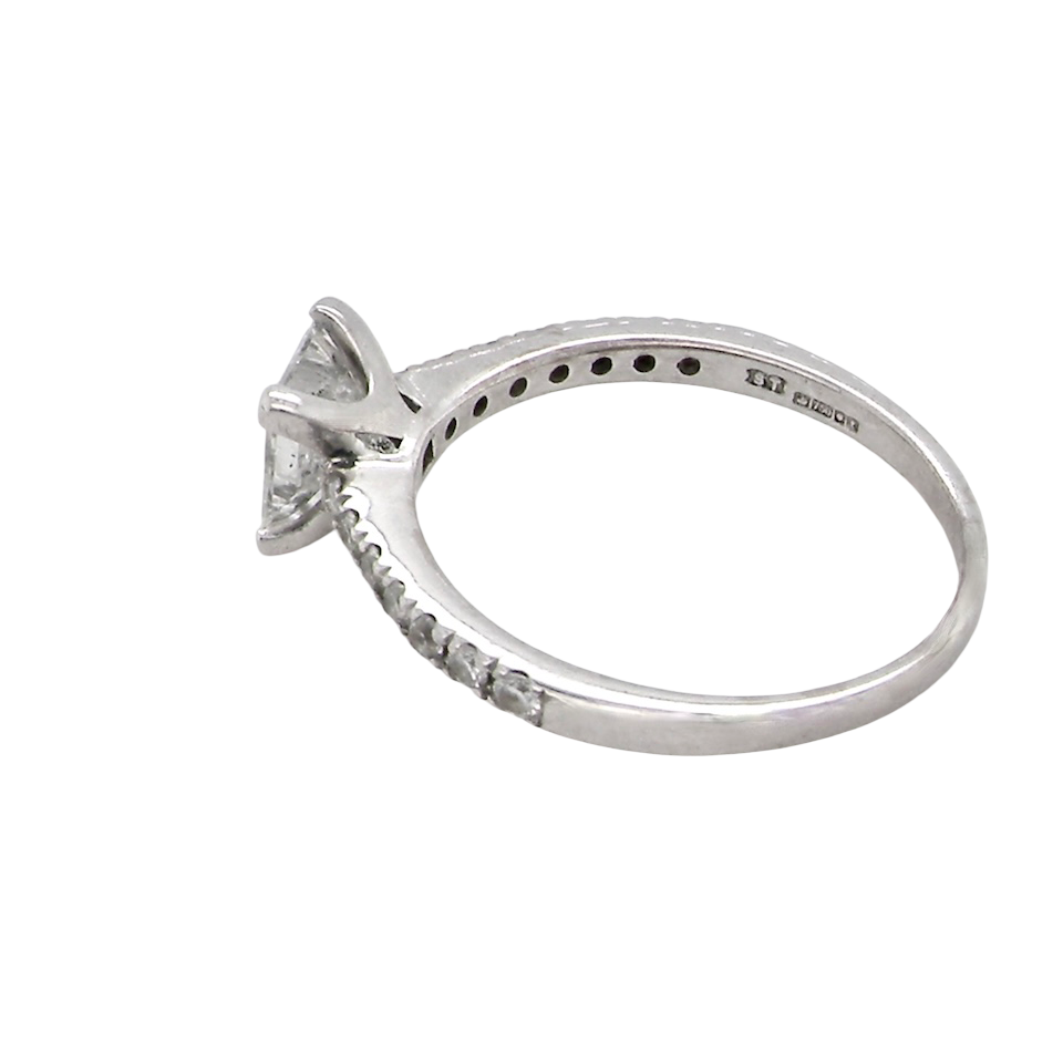 Diamond ring with a white gold band on a white background