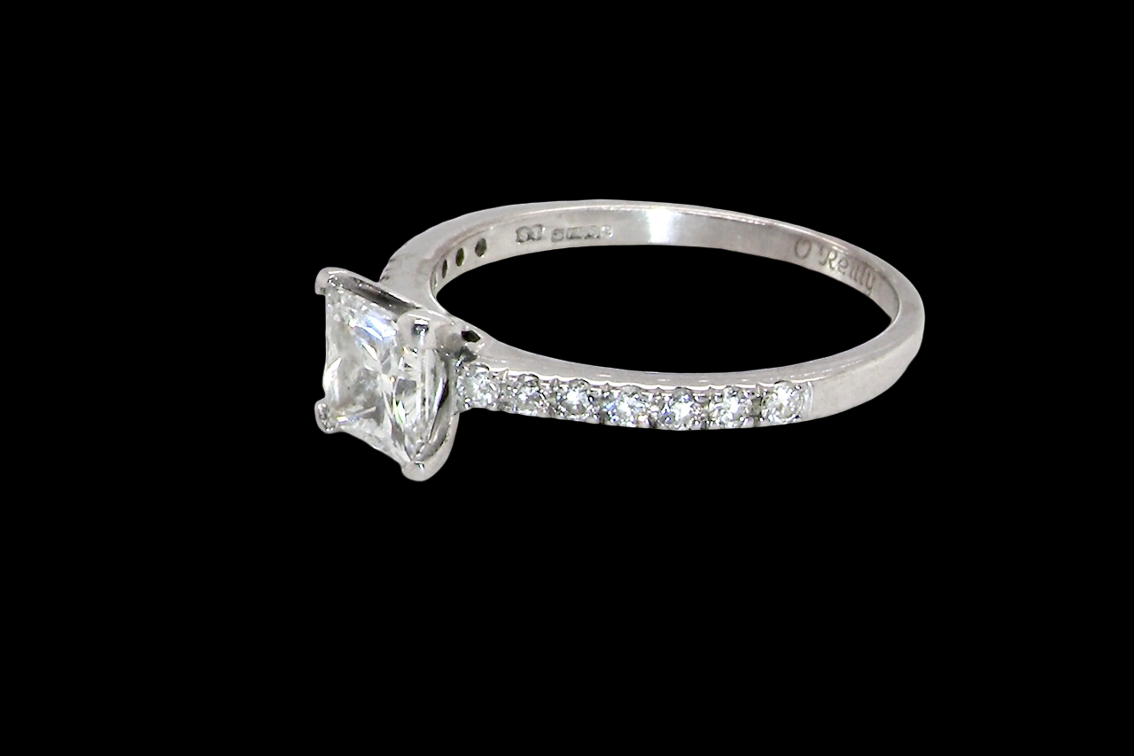 Diamond ring with a clear gemstone on a black background