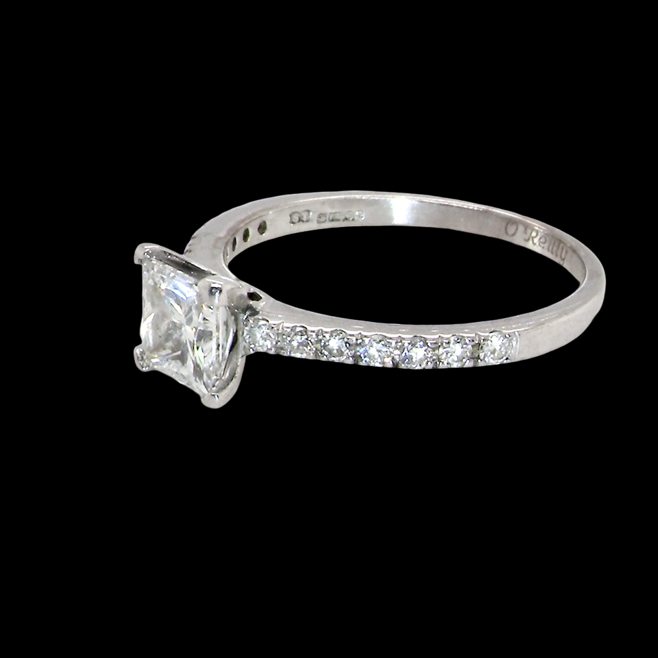 Diamond ring with a clear gemstone on a black background