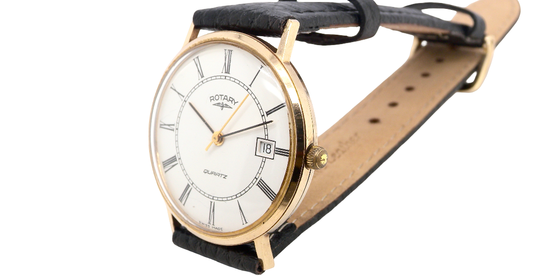 A gentleman's 9 carat gold wrist watch. Plain white dial with roman numerals, sweep seconds hand, and a calendar date window.
Case measures 32mm. Signed by Rotary.