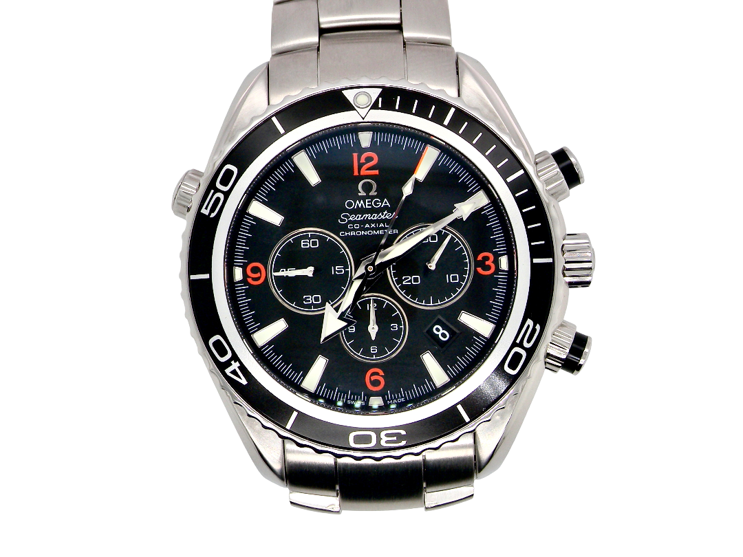 Omega Seamaster Swimmer's watch with a stainless steel bracelet, black dial, and black rotating bezel with white and orange markings.